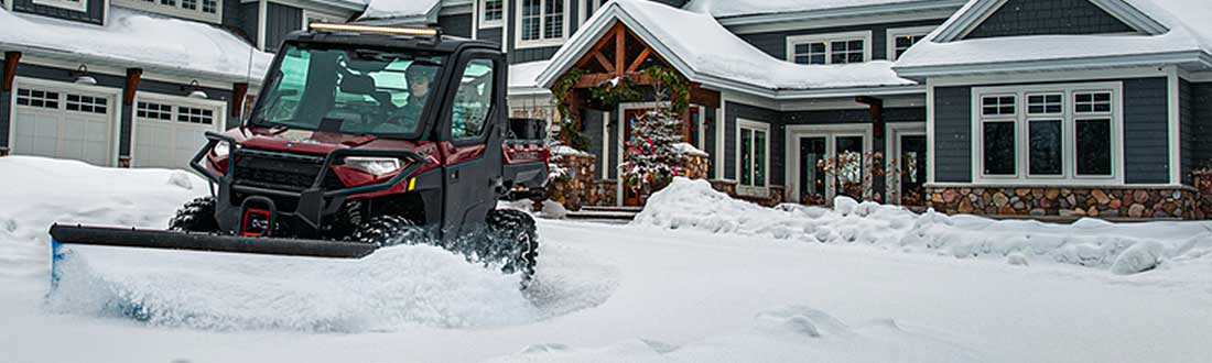 ATV UTV Snow plow shown removing snow at a home near Milwaukee, WI